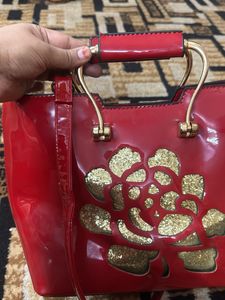 Red Handbag with Floral Detail