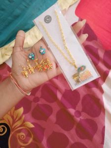 Necklace with chains and lockets