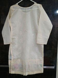 Lovely White Colour Kurti With Beautiful Embroidery Design On It