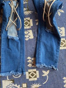 Distressed Lace-Up Jeans