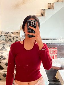 Its A Maroon Colour Crop Top With Long Sleeves