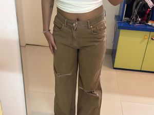 faded brown rugged jeans