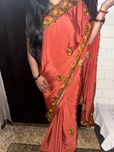 Elegant Orange Saree with Embellished Border