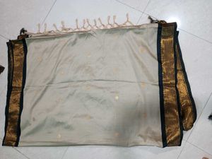Beige Colour Saree With black &amp; Golden Border.