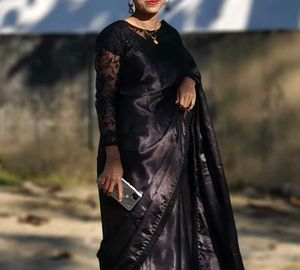 black saree with stiched blouse.