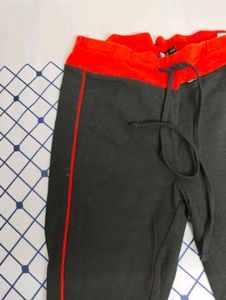 Black Payjama With Red Borders .