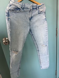 Ripped Light blue denim jeans for women