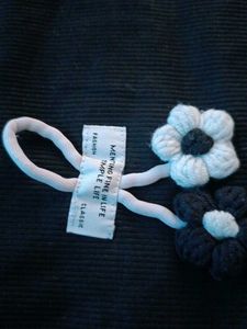 Black top with a knitted flower for women