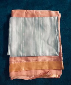 Luxurious Peach Satin Saree with Unstitched Blouse