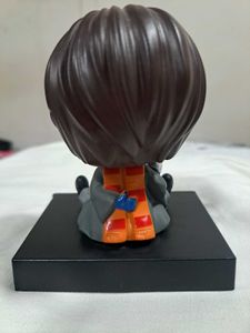 Harry Potter chibi-style figure with Hedwig