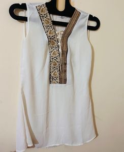 White Sleeveless Top