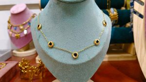 Gold Chain Necklace Featuring black bead or onyx