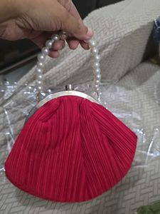 Red Potli Clutch With Pearl Handle - medium