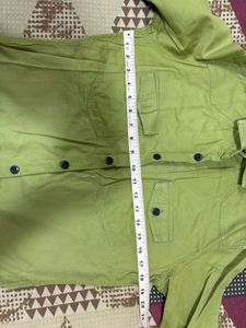 Combo of green shirt and denim jeans