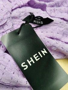 Medium Length Self Designed Eyelet Pattern Top.