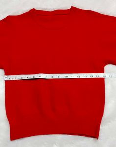 red woolen top
