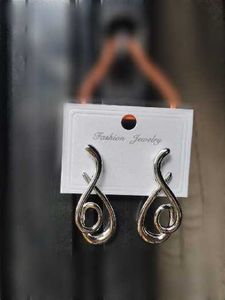 Fashionable Silver and golden Tone Dangle Earrings