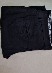 A Black Coloured Men's Wear Jeans Pant.