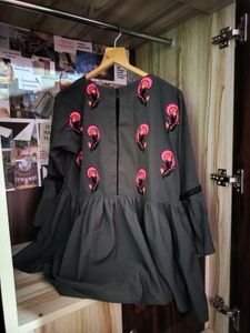 Embroidered Peplum Top