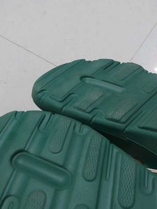 Branded Green flip-flops