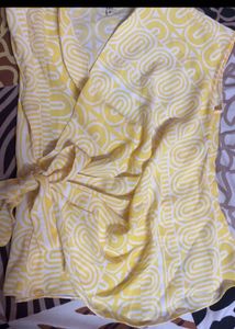 It’s a yellow and white combination top
