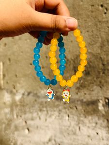 For Brother/Sister, Cute Doraemon Theme Bracelets In Blue And Yellow.