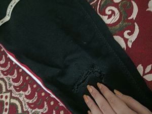Black One Leg Knee Cut Jeans