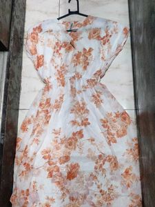 It's a frock orange White Colour