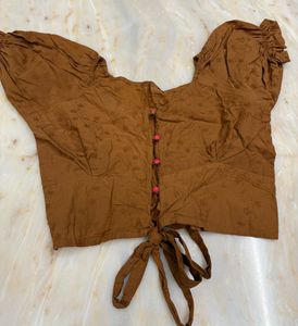 brown crop top with puffy sleeves