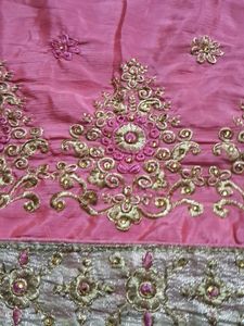 It Is Pink Color Georget With Golden Net Border .