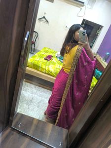 Megenta rajasthani tie-dye saree with bow blouse