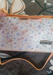 golden colour sling bag