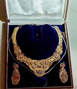 Gold Plated Set .Gorgeous look With Red And green meenakari Work.