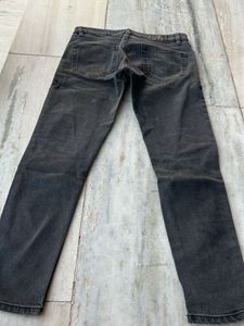 Distressed grey jeans