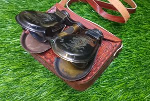 Binocular With A Leather Bag.