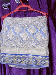 Half net saree with stiched blouse and peticoat