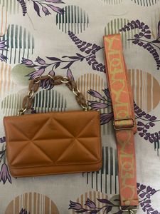 Swiss Beauty Eye Patches And Orange Quilted Bag