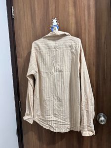 striped light creme shirt.