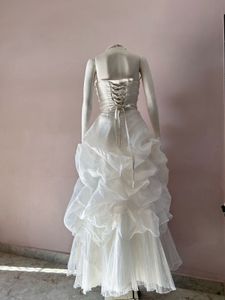 VOLUMINOUS RUFFLED ORGANZA WEDDING GOWN
