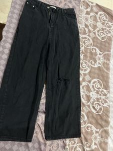 Combo of brown dress and black wide leg jeans