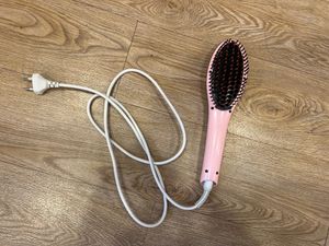 Woman’s hair straightener