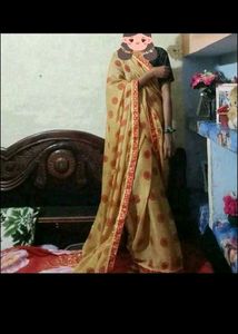 Elegant Beige Saree with Red Accents