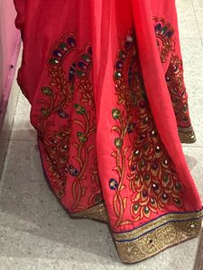 Elegant Pink Sari with Peacock Design