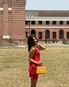 red dress with Polka Dot Handbag both