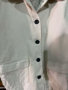 beige jacket with a faux fur collar and cuffs.