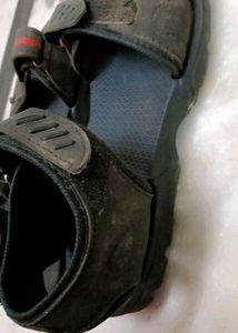A Lightly Used Black Sandle