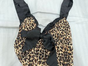 Y2K animal printed top with a cute black bow
