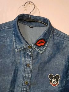 Denim shirt with patches