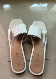 Elegant White Slip-On Sandals by Tokyo Talkies