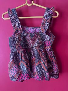 peplum sleeveless top